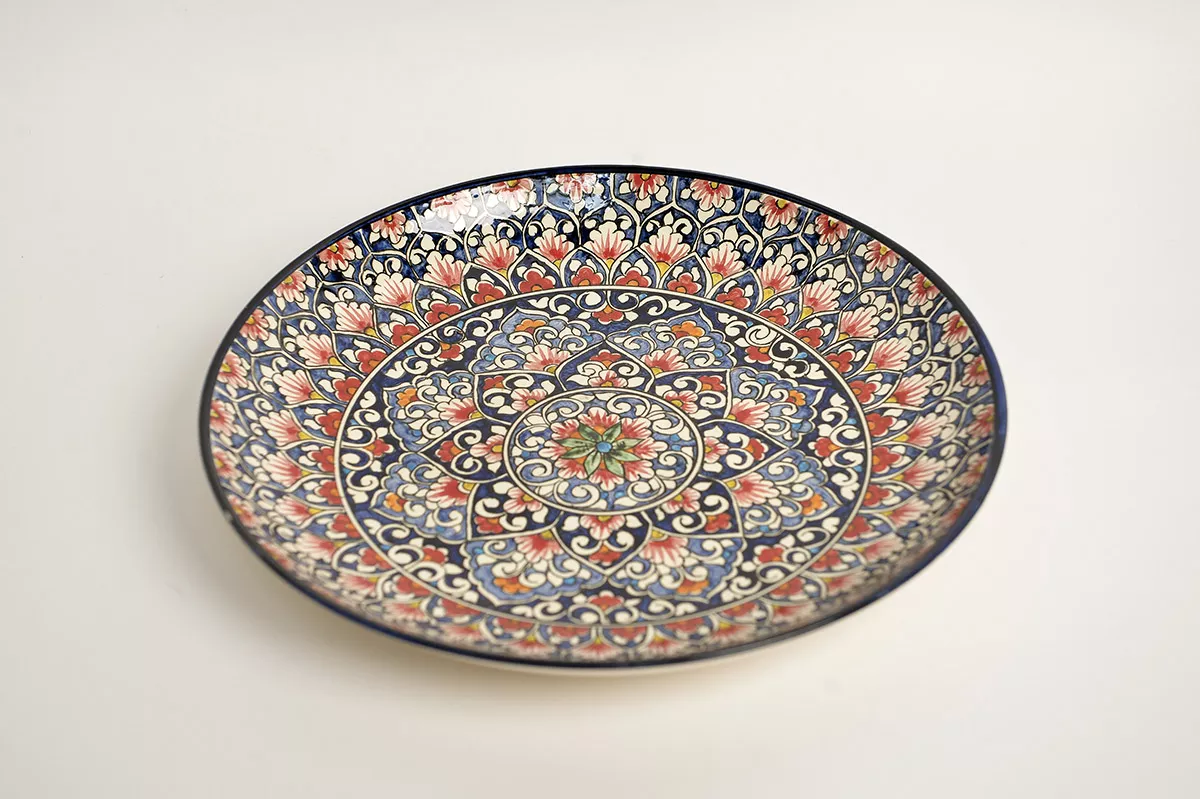 Ceramic plate with gorgeous design in red and blue